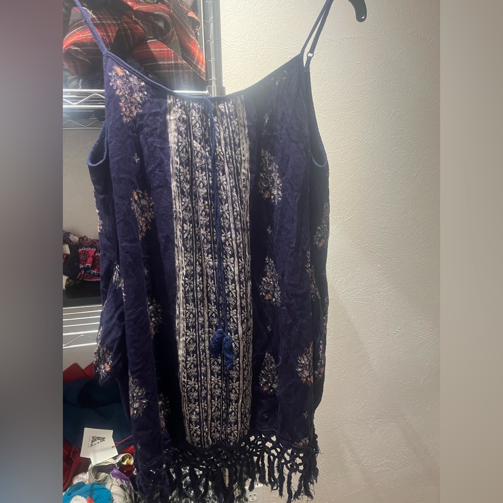 Nice summer dress good as a swimsuitite cover. Blue with floral patterns